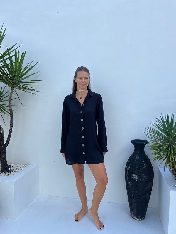 Model wearing MILA black shirt dress as a beach cover-up