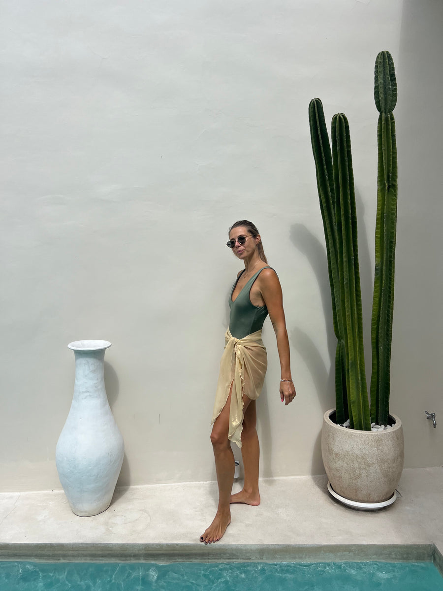 Full view of ELA gold short sarong as a beach cover-up