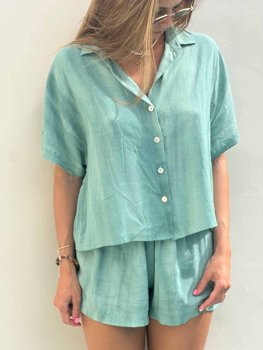 Close-up of the tie-dye pattern on the AURA green shirt