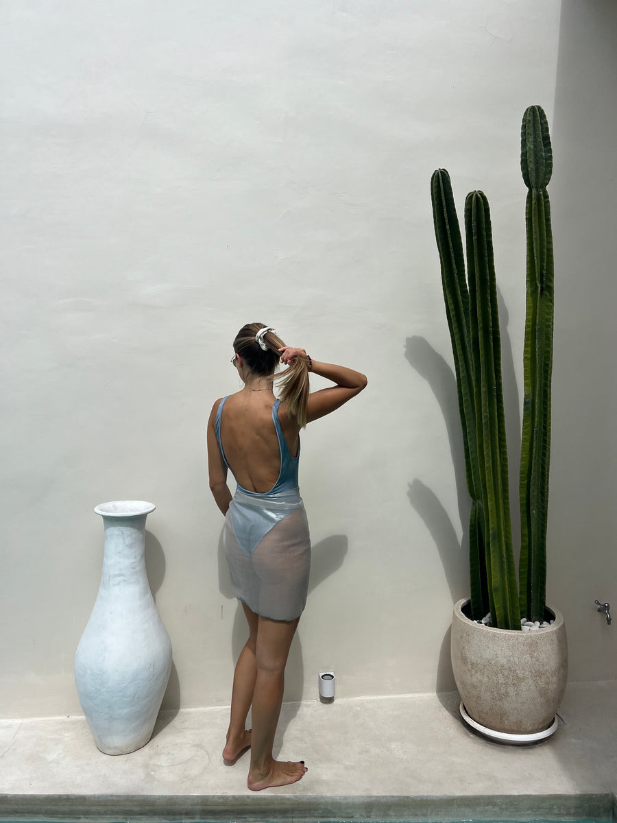 Full view of ELA silver short sarong with flowing drape