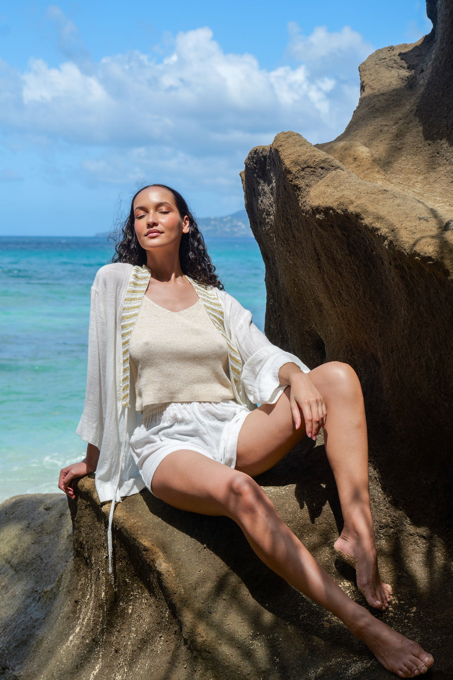 Model styling SUKI white kimono as a beach cover-up