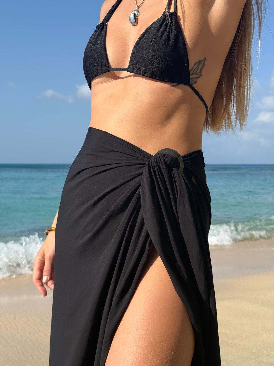Full-length view of PALM black long sarong tied at the waist