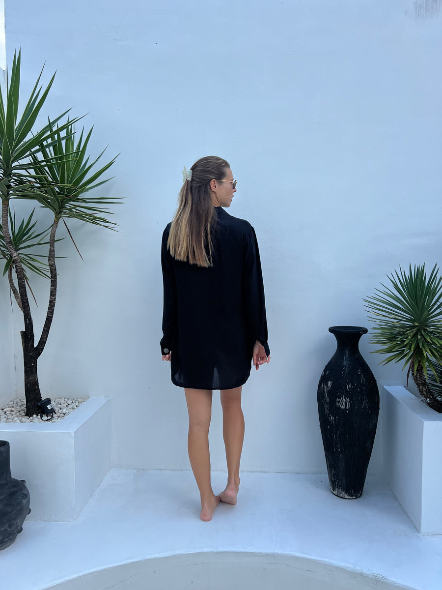 Model in MILA black shirt dress styled as a mini dress